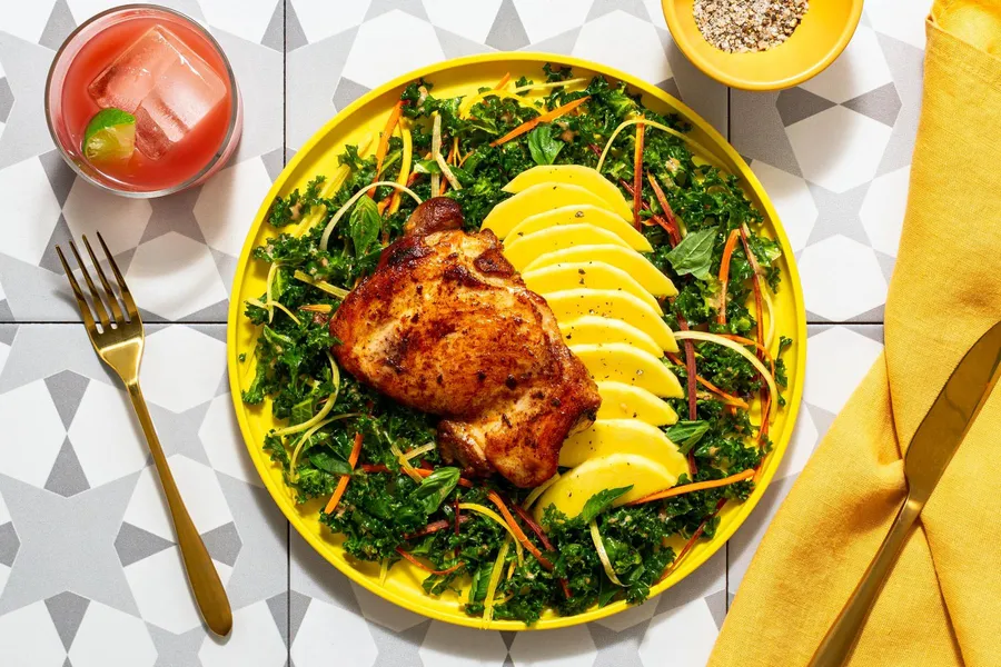 Spicy sambal chicken over kale salad with Thai ginger dressing