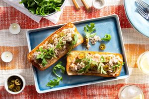 Pulled pork tartines with white bean spread and arugula