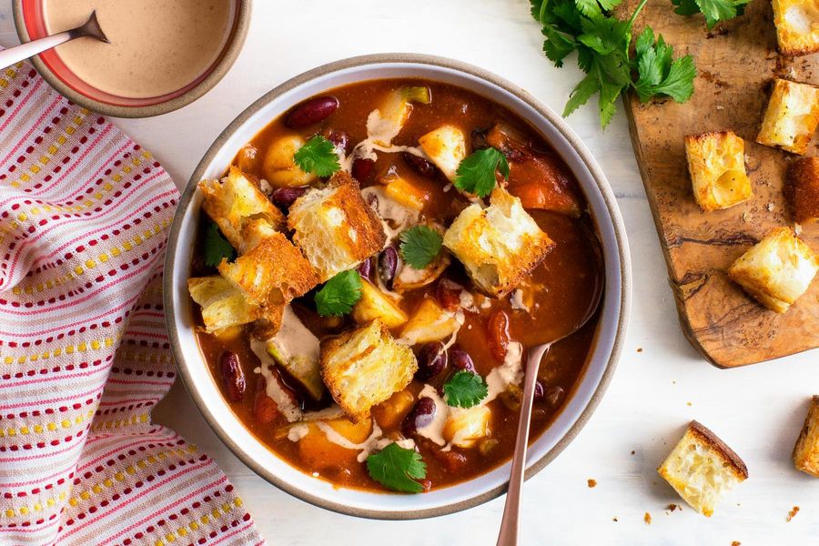 Pumpkin chili with kidney beans and red pepper–cashew crema