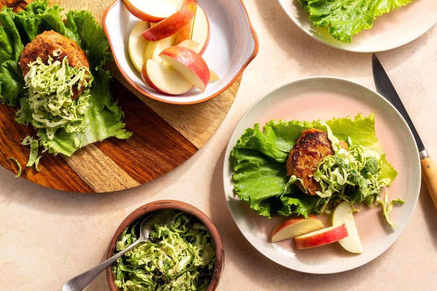 Easy turkey burgers with apple wedges and Brussels sprout slaw