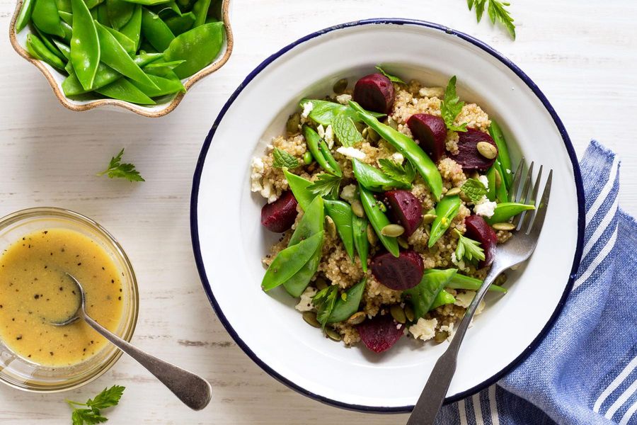 Quinoa bowls with snap peas, beets, feta, and mint