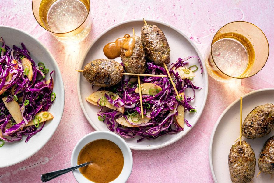 Ginger-scallion skewers with apple and cabbage slaw