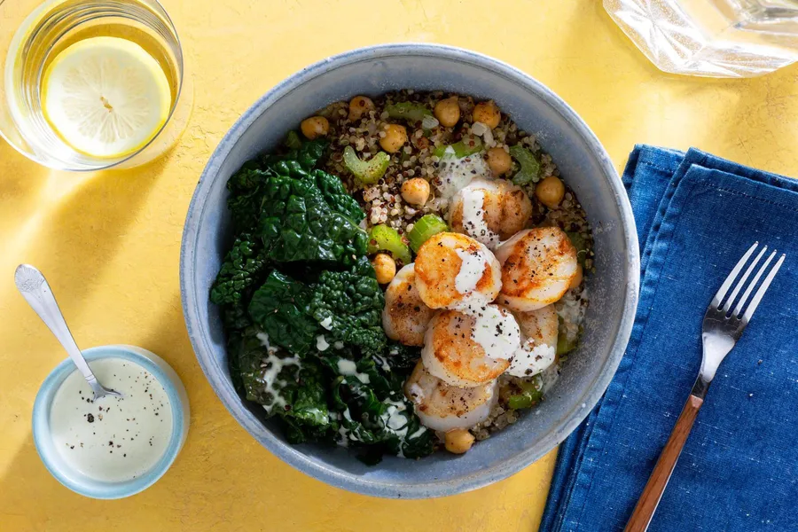 Quinoa bowls with wilted greens and citrus dressing