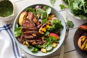 Steak and stone fruit salad with walnuts and ginger-basil dressing