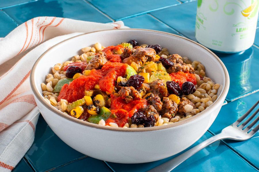 Louisiana-style beef and barley bowl with spicy red pepper sauce