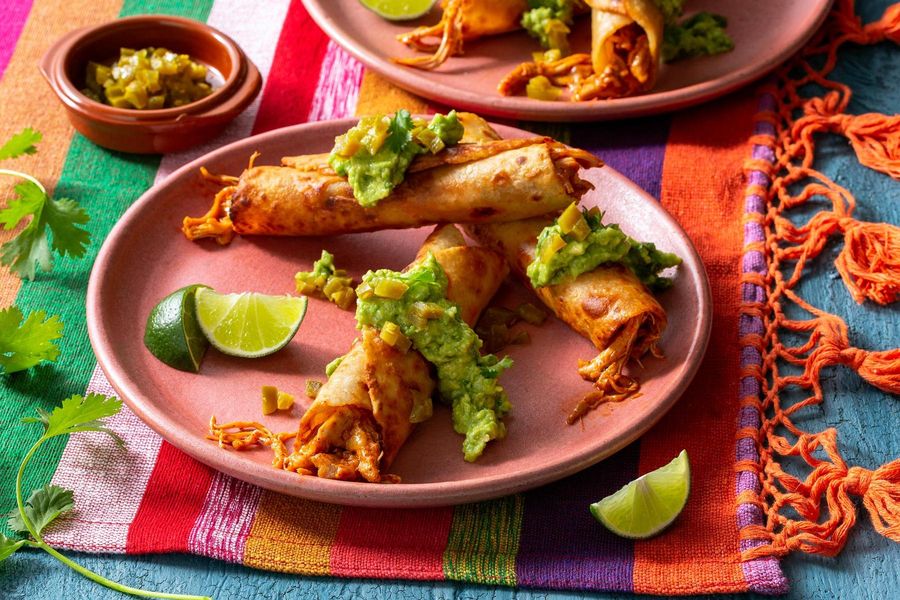 Chicken taquitos with guacamole and pickled jalapeños