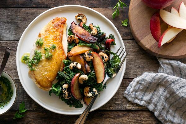 Roasted chicken breasts with sautéed kale and apples