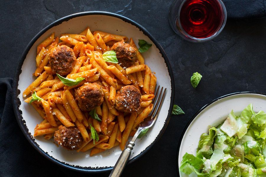 Penne and meatballs in marinara sauce with Caesar salad