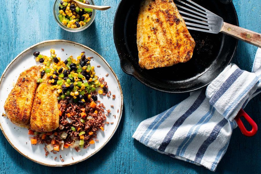 Blackened sole with red rice and charred corn–black bean salsa