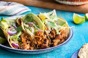 Pork carnitas tacos with cabbage slaw and avocado
