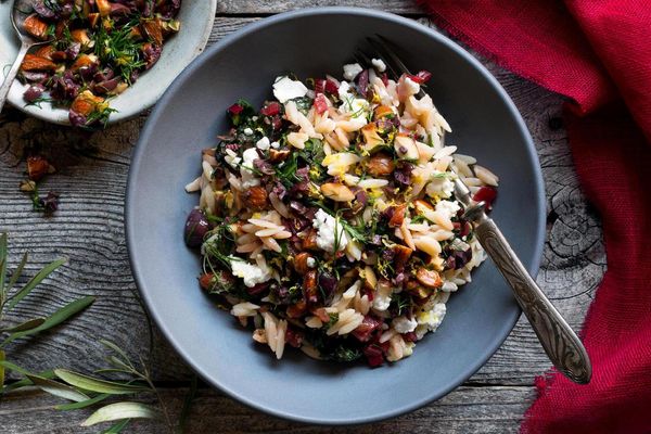 Gluten-free orzo bowl with chard and olive-almond relish