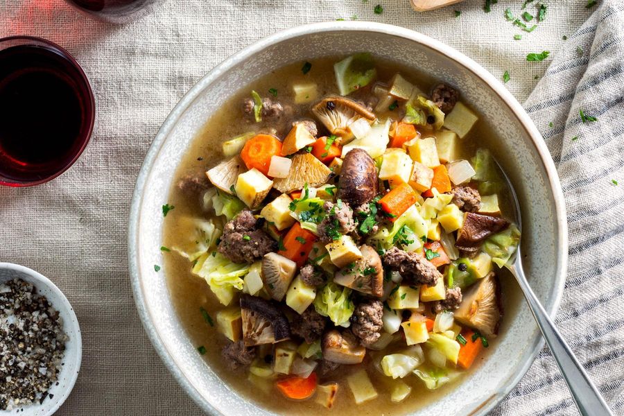 Hearty beef soup with sweet potato and cabbage