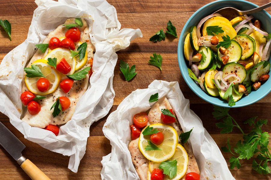 Sole in parchment and zucchini salad with roasted almonds