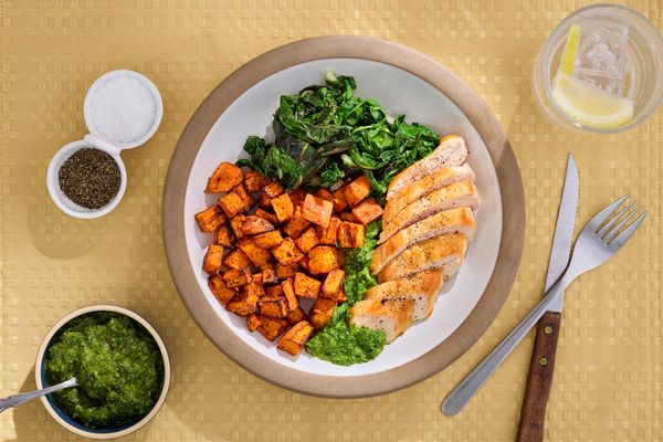Steaks with chimichurri and harissa-roasted sweet potatoes