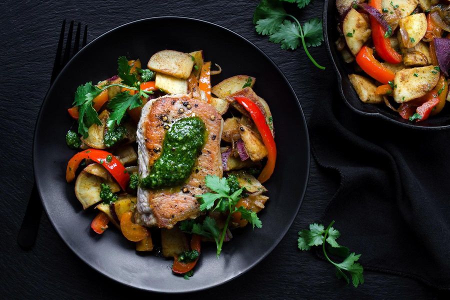 Roasted pork chops with sweet potato hash and cilantro pesto