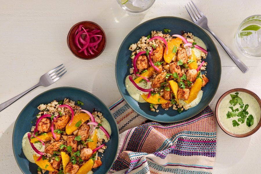 Peruvian-style orange–cauliflower “rice” with cilantro aioli and your choice of protein