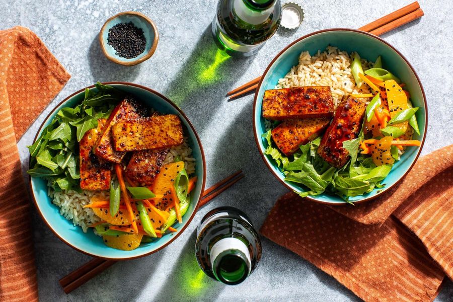 Sweet and sticky tofu rice bowls with pickled greens and orange salad