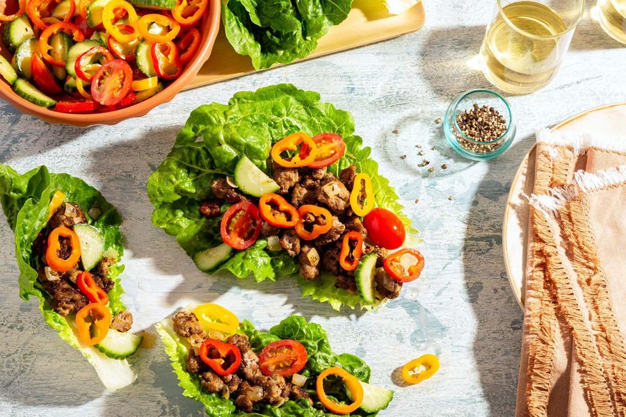 Greek lettuce cups with sweet mini peppers, cucumber, and tomatoes