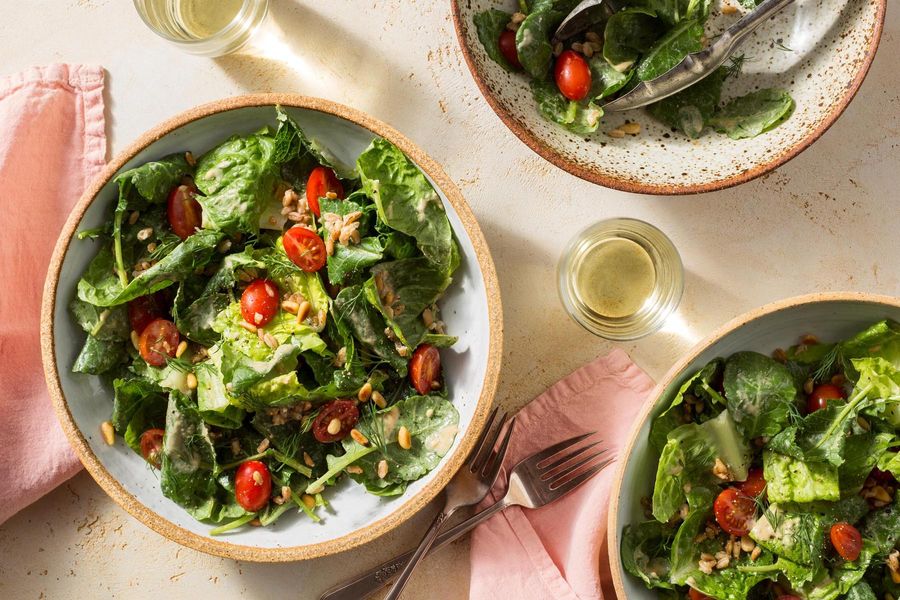 Vegan kale and farro Caesar salad with pine nuts and tomatoes