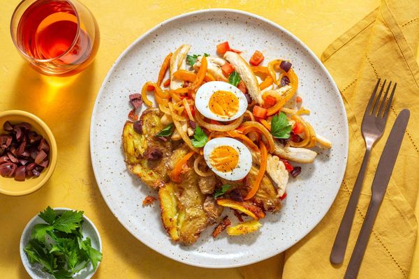 Sausages with smashed potatoes and warm Tunisian mechouia salad