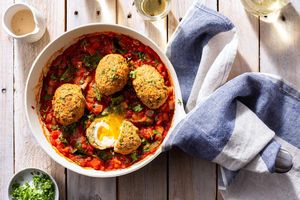 Spicy shakshuka with falafel “Scotch” eggs and lemon-tahini sauce