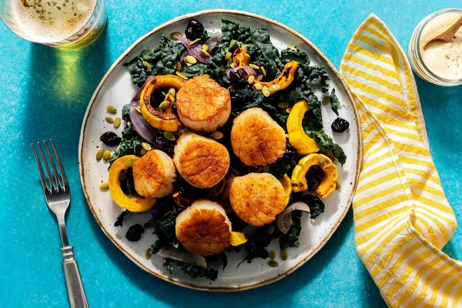 Kale salad with your choice of protein, squash, and dried cherries