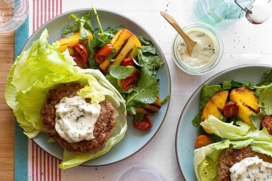 Lettuce-wrapped turkey burgers with basil mayo and warm peach salad