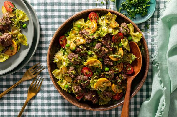 Farfalle with ground beef, yellow squash, and arugula-pistachio pesto