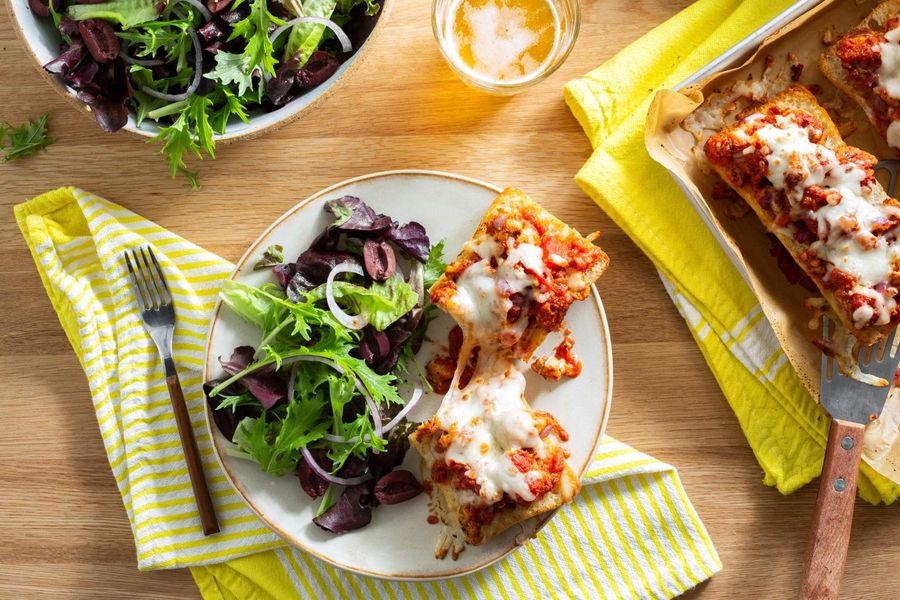 Turkey sausage pizza bread with mixed green salad