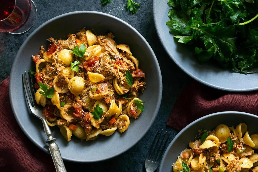 Pork sugo with orecchiette and baby kale salad