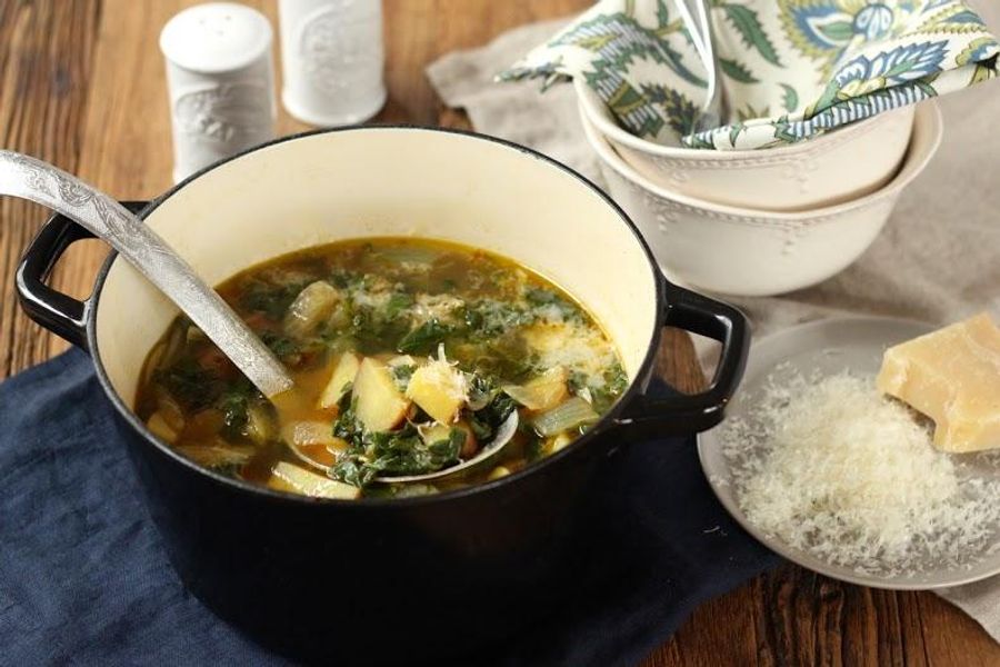 Spicy kale and potato stew with grated parmesan