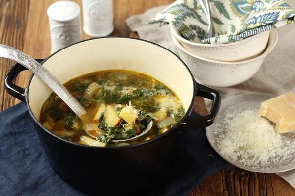 Spicy kale and potato stew with grated parmesan