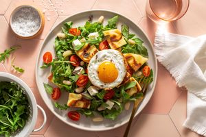 White bean panzanella with tomatoes, fresh mozzarella, and fried eggs