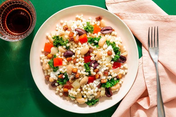Pancetta and kale couscous with olives and creamy feta dressing