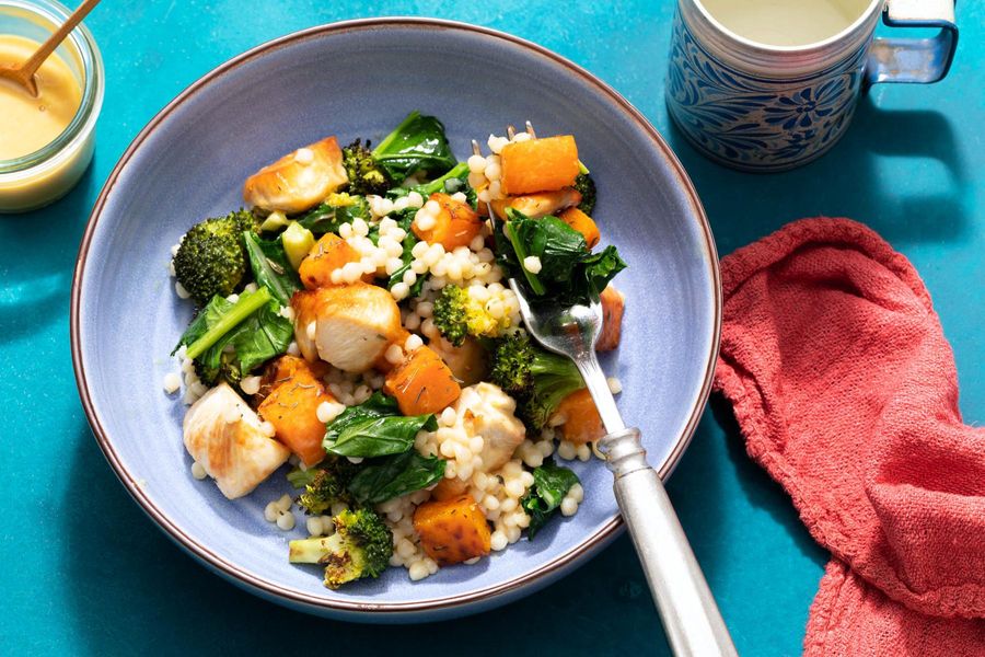 Couscous salad with chicken, butternut squash, and broccoli leaves