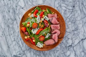 Steak salad with roasted red peppers, Kalamata olives, and blue cheese