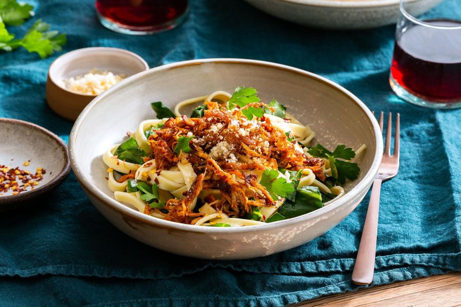 Fresh fettuccine with braised pork, wilted greens, and Parmesan