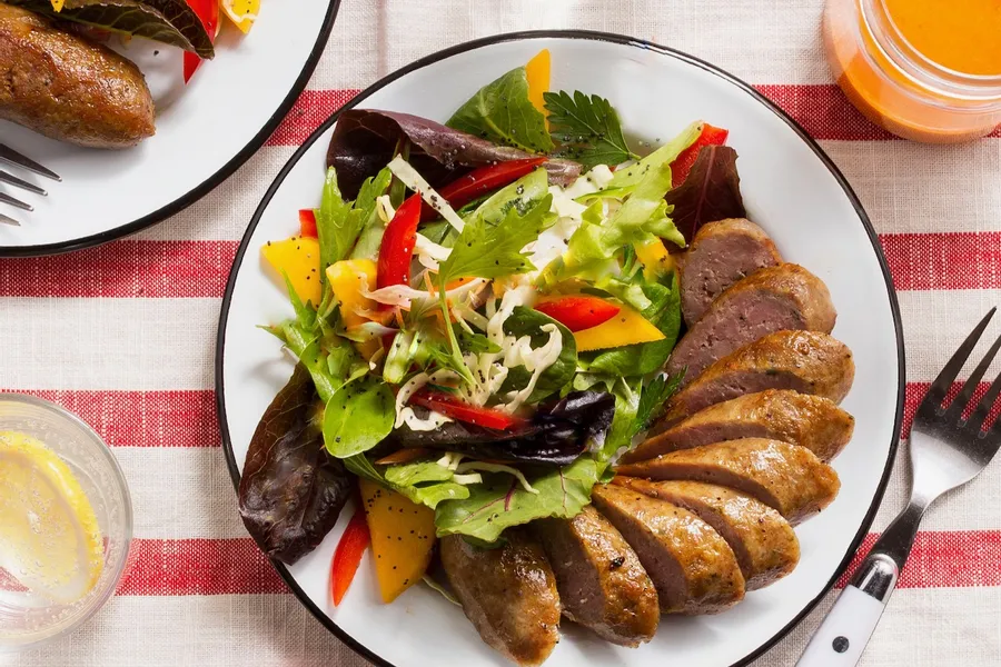 Italian sausages with insalata mista and red pepper vinaigrette Also available with chicken sausages