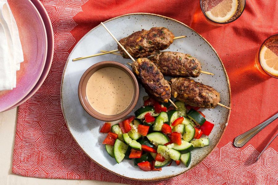 Turkish lamb köfte with tahini sauce and smashed cucumber salad