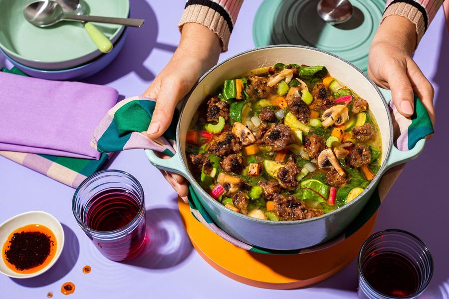 Hearty soup with zucchini, rainbow chard, and Urfa chile oil
