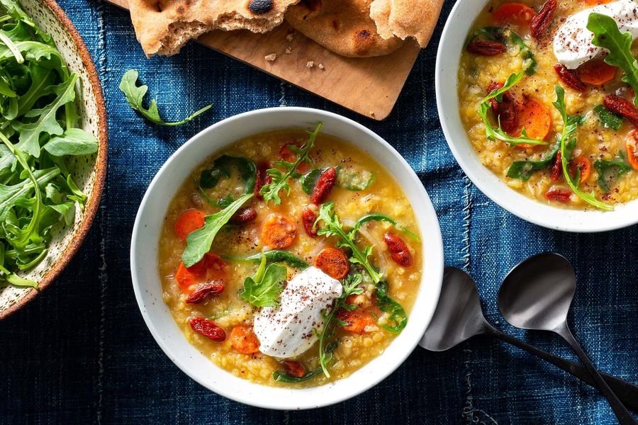 Red lentil–carrot soup with arugula and toasted naan