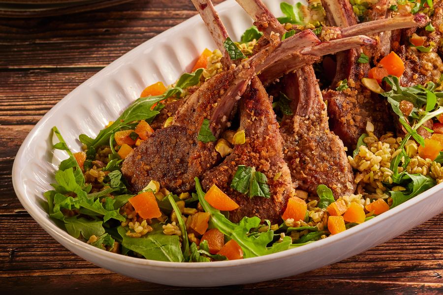 Lamb chops with warm freekeh salad, dried apricots, and pistachios