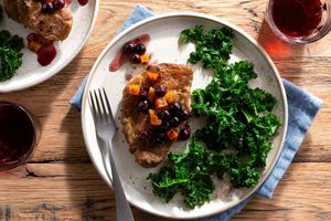 Pork loin chops with blueberry-apricot sauce and sautéed kale
