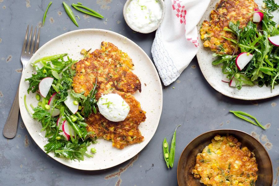 Corn fritters with baby kale, snap pea, and radish salad 