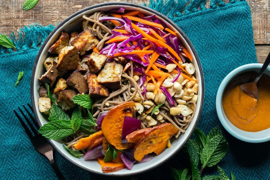Buddha bowls with braised tofu, soba noodles, and cashew-lime dressing