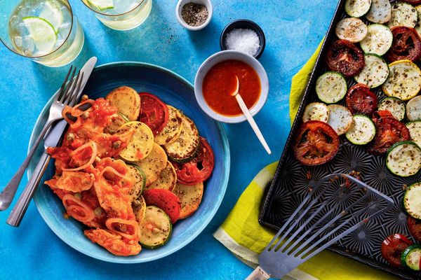 Tomato-braised pollock over roasted zucchini and new potatoes