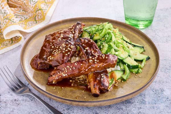 Orange glazed ribs with cucumber tiger salad and rice