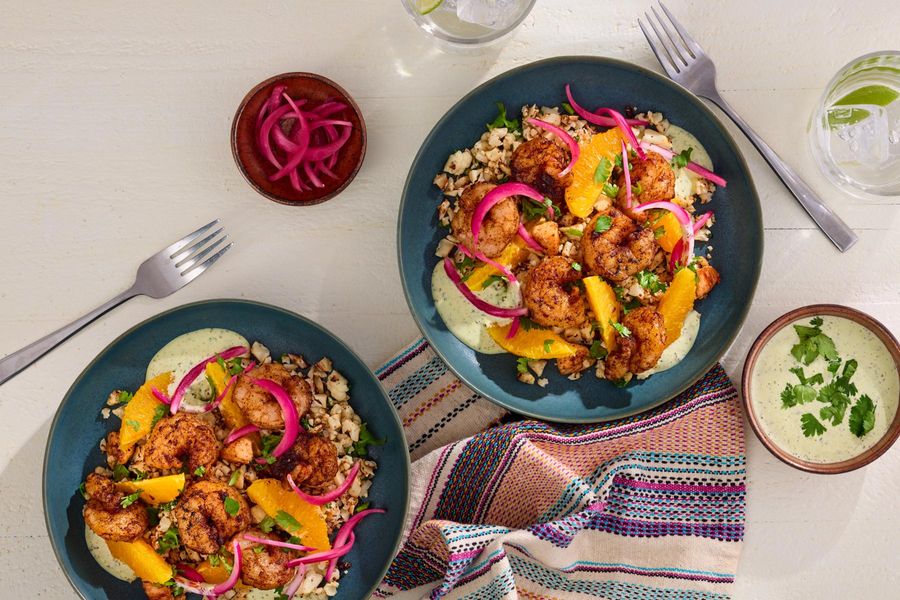Peruvian-style orange–cauliflower “rice” with cilantro aioli and your choice of protein