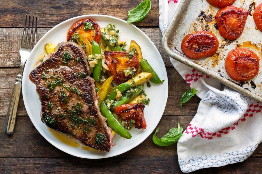 Seared steak with charred tomatoes and basil-walnut dressing