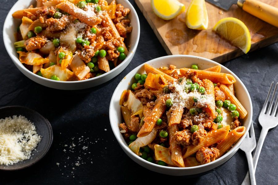 Fresh penne with Italian sausage, endive, and peas